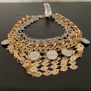 Cool necklace with leather gold and silver! Fits close to neck!